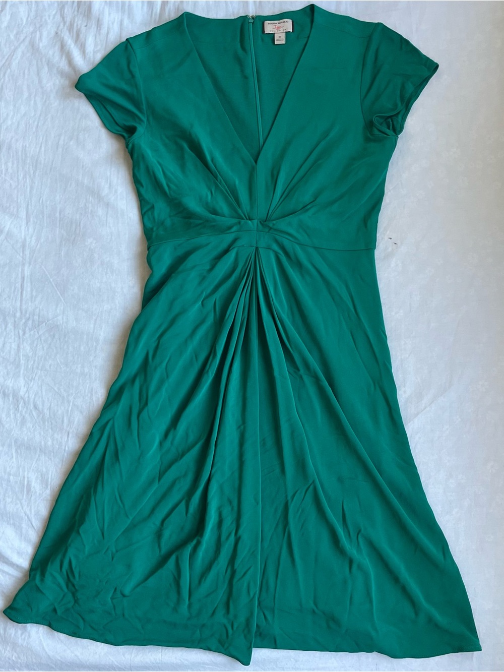 sage green dress with a twist detail